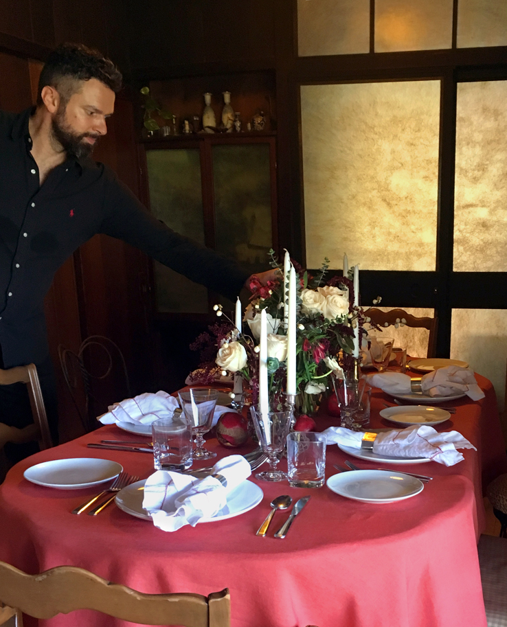 Traditional Christmas brunch in the Hollywood Hills with red, white and green floral centerpiece with white roses